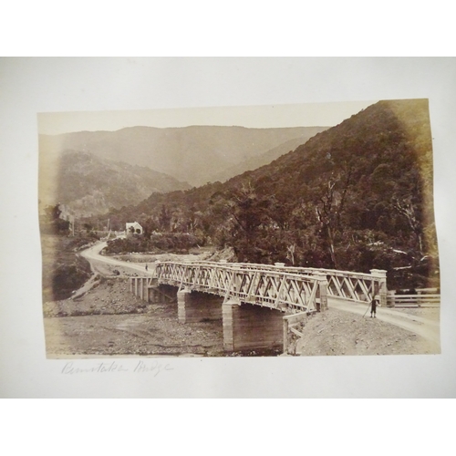 9044 - A 19th Century photograph album containing approx. 100 mounted albumen print etc photographs mainly ... 