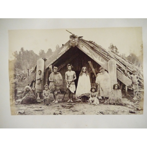 9044 - A 19th Century photograph album containing approx. 100 mounted albumen print etc photographs mainly ... 