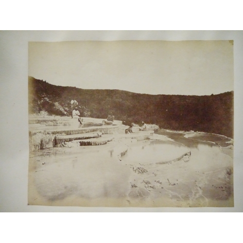 9044 - A 19th Century photograph album containing approx. 100 mounted albumen print etc photographs mainly ... 