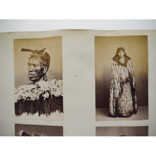 9044 - A 19th Century photograph album containing approx. 100 mounted albumen print etc photographs mainly ... 