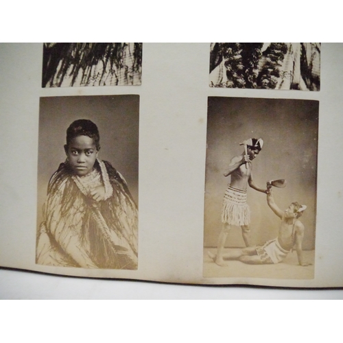 9044 - A 19th Century photograph album containing approx. 100 mounted albumen print etc photographs mainly ... 