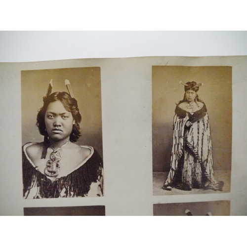 9044 - A 19th Century photograph album containing approx. 100 mounted albumen print etc photographs mainly ... 