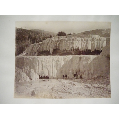 9044 - A 19th Century photograph album containing approx. 100 mounted albumen print etc photographs mainly ... 