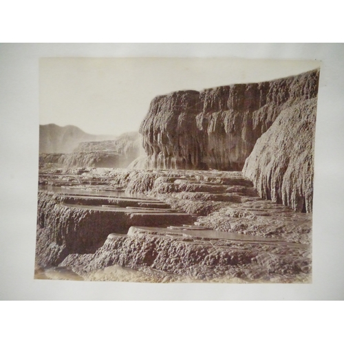 9044 - A 19th Century photograph album containing approx. 100 mounted albumen print etc photographs mainly ... 
