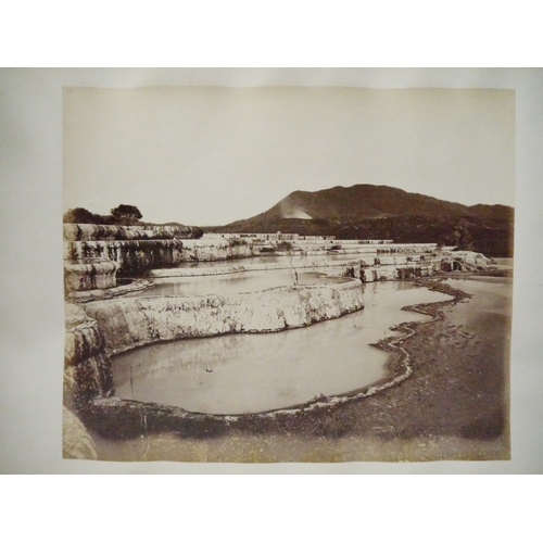 9044 - A 19th Century photograph album containing approx. 100 mounted albumen print etc photographs mainly ... 
