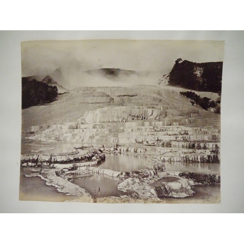 9044 - A 19th Century photograph album containing approx. 100 mounted albumen print etc photographs mainly ... 