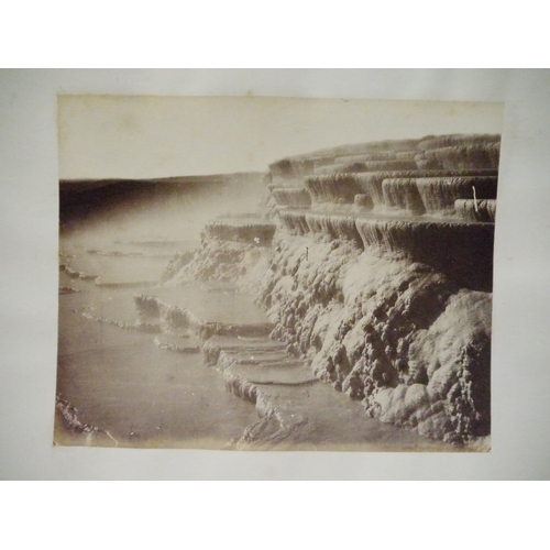 9044 - A 19th Century photograph album containing approx. 100 mounted albumen print etc photographs mainly ... 