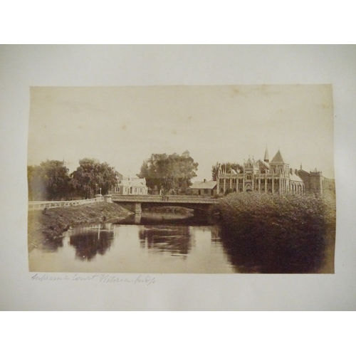 9044 - A 19th Century photograph album containing approx. 100 mounted albumen print etc photographs mainly ... 