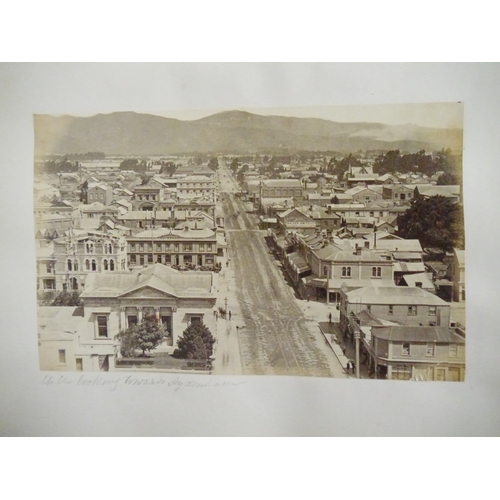 9044 - A 19th Century photograph album containing approx. 100 mounted albumen print etc photographs mainly ... 