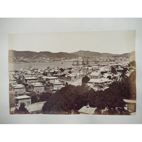 9044 - A 19th Century photograph album containing approx. 100 mounted albumen print etc photographs mainly ... 
