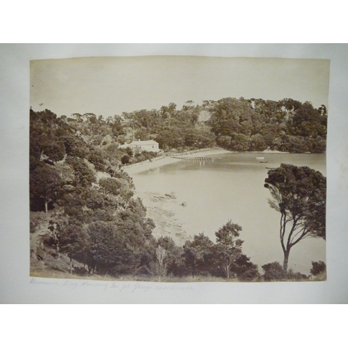 9044 - A 19th Century photograph album containing approx. 100 mounted albumen print etc photographs mainly ... 