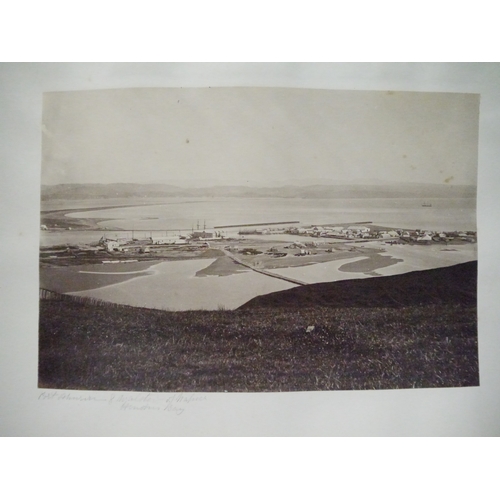 9044 - A 19th Century photograph album containing approx. 100 mounted albumen print etc photographs mainly ... 