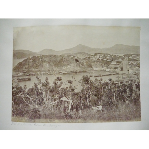 9044 - A 19th Century photograph album containing approx. 100 mounted albumen print etc photographs mainly ... 