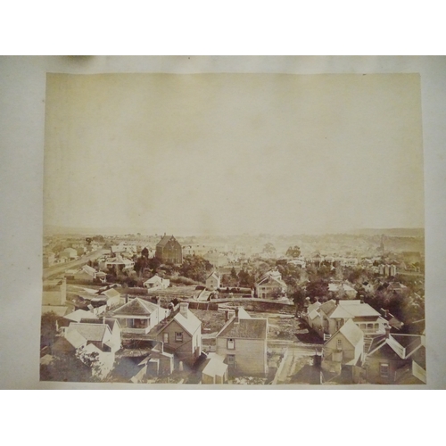9044 - A 19th Century photograph album containing approx. 100 mounted albumen print etc photographs mainly ... 