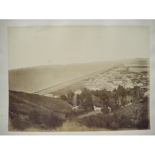 9044 - A 19th Century photograph album containing approx. 100 mounted albumen print etc photographs mainly ... 