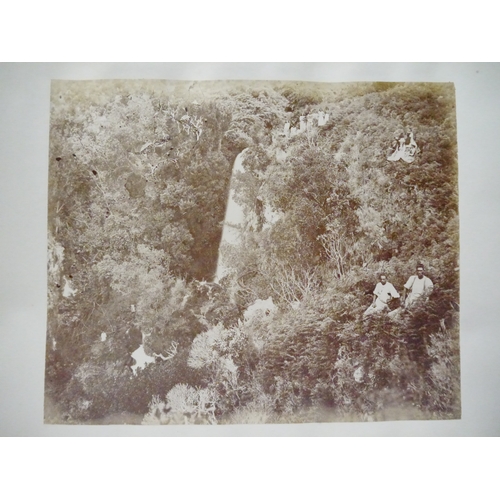 9044 - A 19th Century photograph album containing approx. 100 mounted albumen print etc photographs mainly ... 