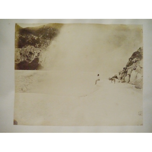 9044 - A 19th Century photograph album containing approx. 100 mounted albumen print etc photographs mainly ... 