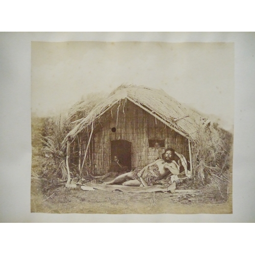 9044 - A 19th Century photograph album containing approx. 100 mounted albumen print etc photographs mainly ... 