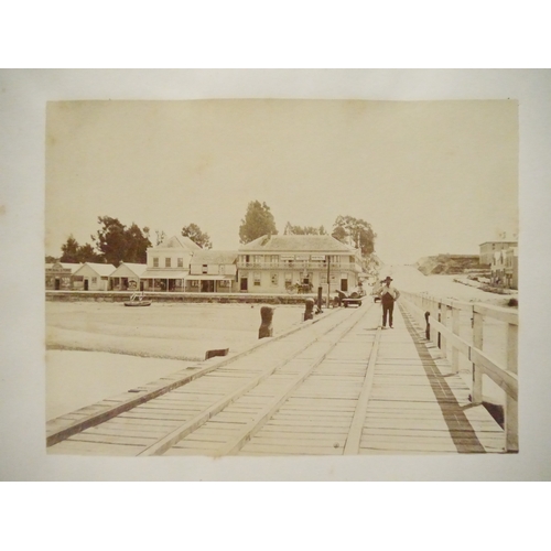 9044 - A 19th Century photograph album containing approx. 100 mounted albumen print etc photographs mainly ... 