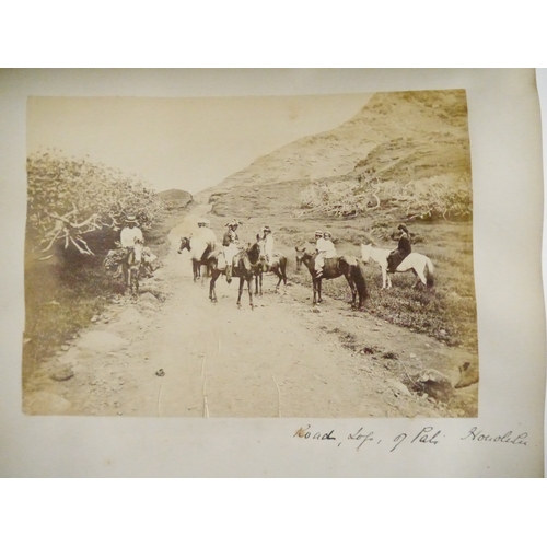 9044 - A 19th Century photograph album containing approx. 100 mounted albumen print etc photographs mainly ... 