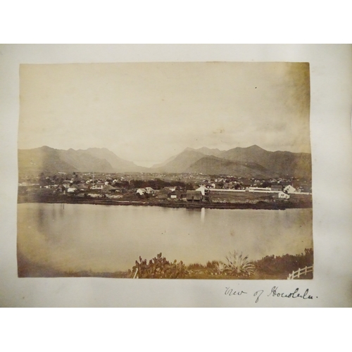 9044 - A 19th Century photograph album containing approx. 100 mounted albumen print etc photographs mainly ... 