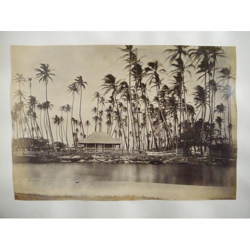 9044 - A 19th Century photograph album containing approx. 100 mounted albumen print etc photographs mainly ... 