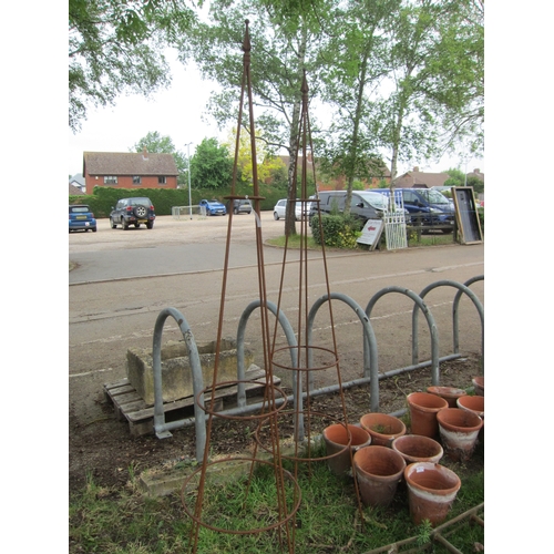8011 - A pair of steel rust finish spike top obelisks