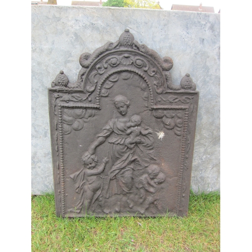 8041 - A cast iron fire back with decorative shaped top, central image depicting woman with children, 61cm ... 