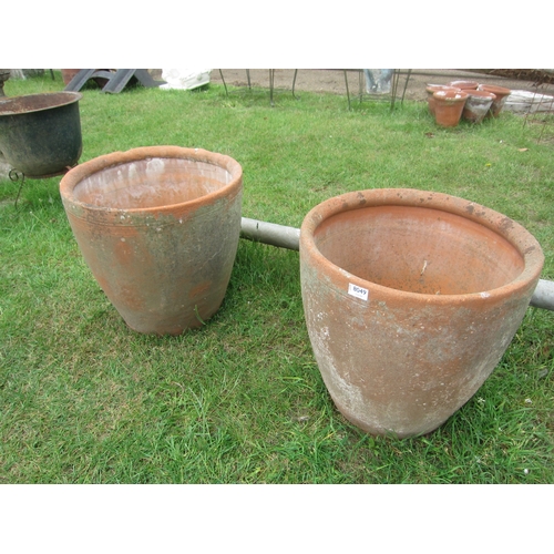 8049 - A pair of terracotta bulbous planters, 49cm diameter x 45cm high