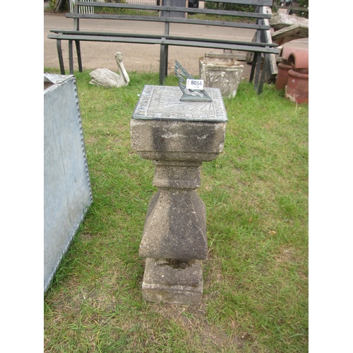 8056 - A square brass dial sundial on shaped concrete base, 68cm tall