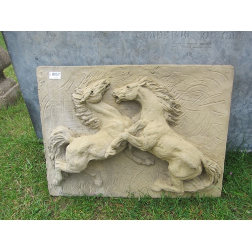 8057 - A composition plaque of rearing horses, 63cm (w) x 46cm (h)