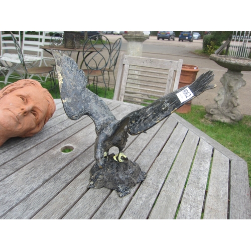 8062 - A black painted metal figure of an eagle, 29cm tall
