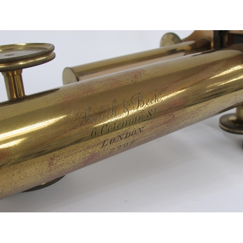 7041 - A mid 19th Century Smith & Beck brass microscope, housed within a wooden case, the microscope inscri... 