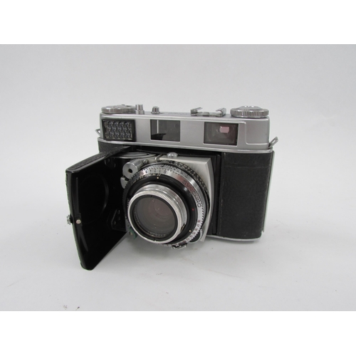 7058 - A mid 20th Century Kodak Retina IIIC folding film camera in leather case, serial 72454