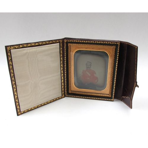 7022 - Mid 19th Century hand coloured ambrotype picture of a military officer, the seated gentleman wearing... 