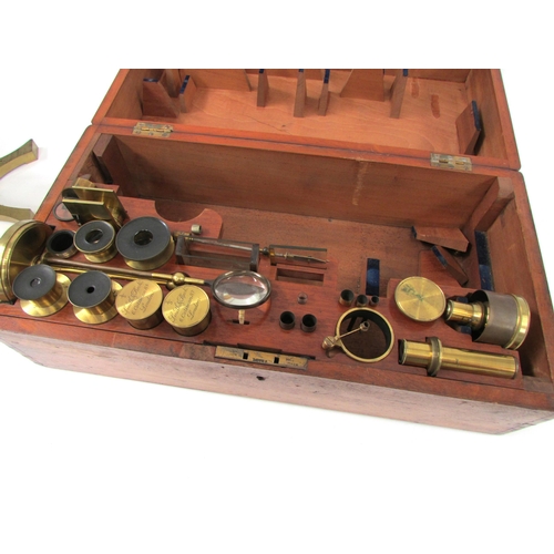 7041 - A mid 19th Century Smith & Beck brass microscope, housed within a wooden case, the microscope inscri... 