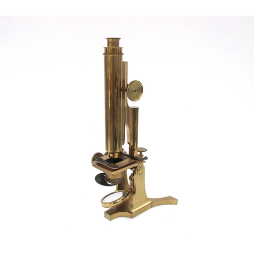 7041 - A mid 19th Century Smith & Beck brass microscope, housed within a wooden case, the microscope inscri... 