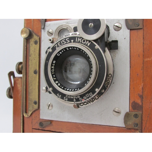 7044 - A mahogany and brass half-plate field camera, with Zeiss Ikon Compur shutter having a Carl Zeiss Jen... 