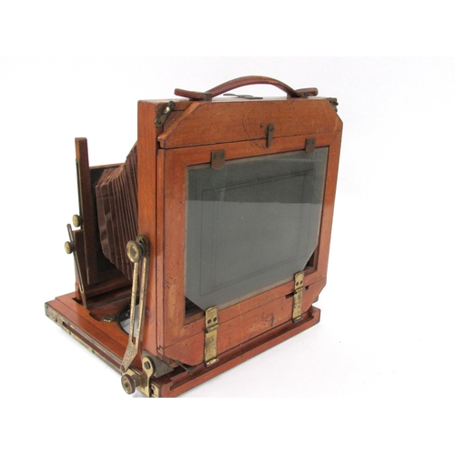 7044 - A mahogany and brass half-plate field camera, with Zeiss Ikon Compur shutter having a Carl Zeiss Jen... 