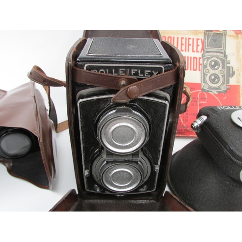 7051 - A Rolleiflex DRP DRGM twin lens TLR film camera, serial 817597, with a Rollei binocular camera exten... 