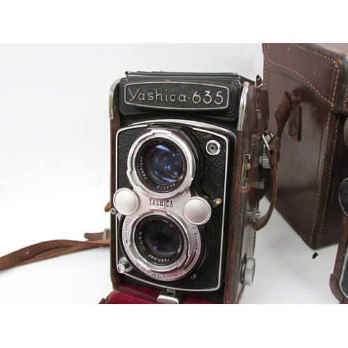 7053 - Two TLR twin lens cameras to include a Yashica 635, and a Zeiss Ikon Ikoflex II, both in leather cas... 