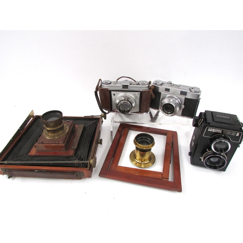 7052 - A group of photographic equipment including an Olympus 35-S, Kodak Retinette, vintage mahogany plate... 