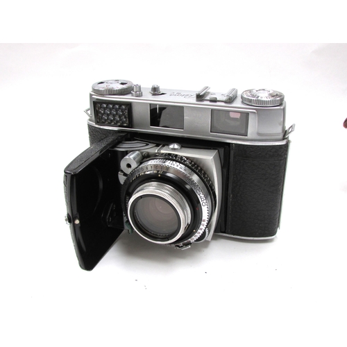 7058 - A mid 20th Century Kodak Retina IIIC folding film camera in leather case, serial 72454