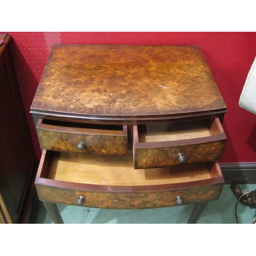 4055 - A Circa 1920 George II style burr walnut bow front chest of two short over single long drawer on pad... 
