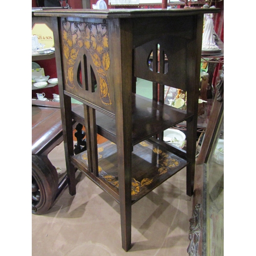 4011 - Probably Scottish Arts & Crafts, a carved floral pine three tier lamp table with canted corner top, ... 