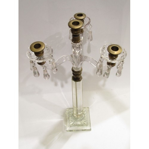 4062 - A Victorian cut glass and brass three arm candelabrum with crystal drops, 61cm tall