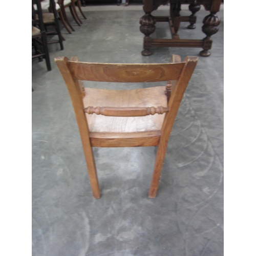 2022 - A Georgian elm knife back elbow chair