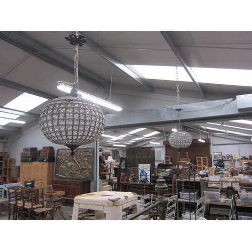 2021 - A pair of gilt metal and bead work hanging lights