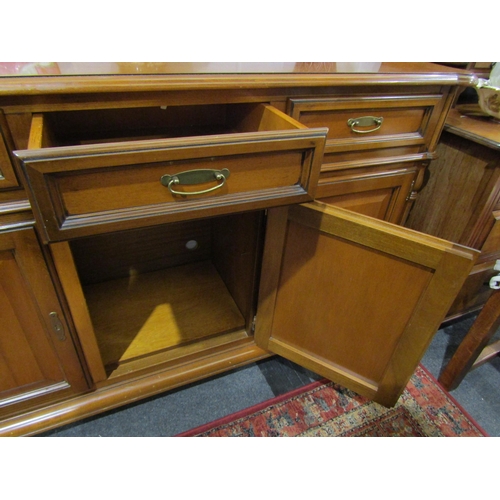 1057 - A four drawer over four door cupboard sideboard reeded turned column decoration (with key) 90cm tall... 