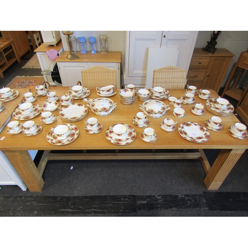 1022 - A modern light oak dining table, reeded square legs, together with a set of four rattan dining chair... 